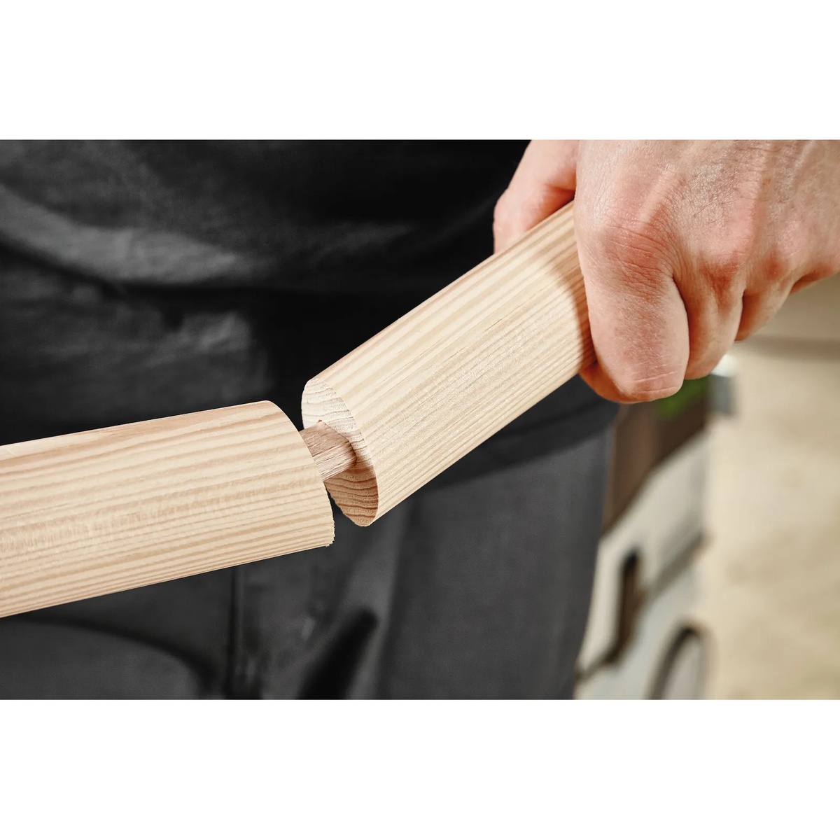 Festool Domino DF 500 Sipo Outdoor Tenons connecting round wood parts during furniture assembly in a woodworking shop