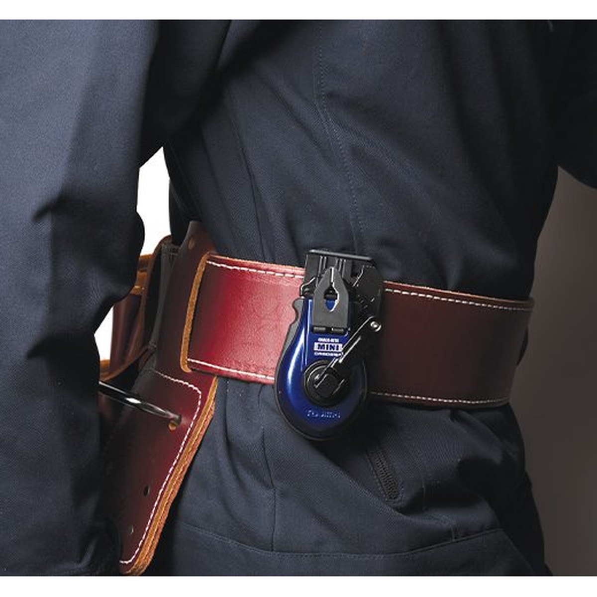 Tajima CR802SFB Chalk-Rite MINI Chalk Line clipped on a work belt during construction layout work for quick access on the jobsite