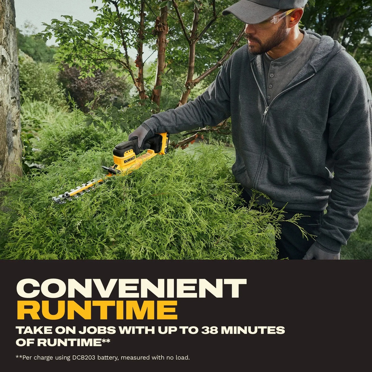 DeWALT DCHT823D1 20V MAX 8-in. Cordless Compact Hedge Trimmer Kit trimming dense shrub growth in a landscaped yard