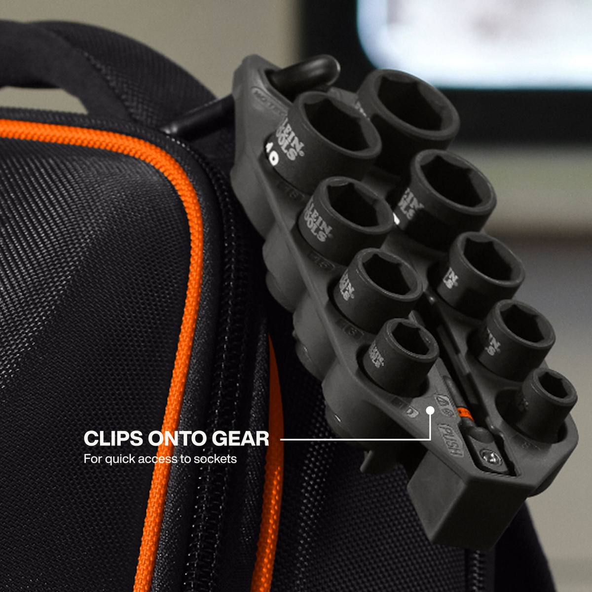 Klein 33809M Grab-And-Go Impact Socket Set, Metric, 10-Piece clipped to a tool bag for quick-access fastening work in a service and maintenance setting