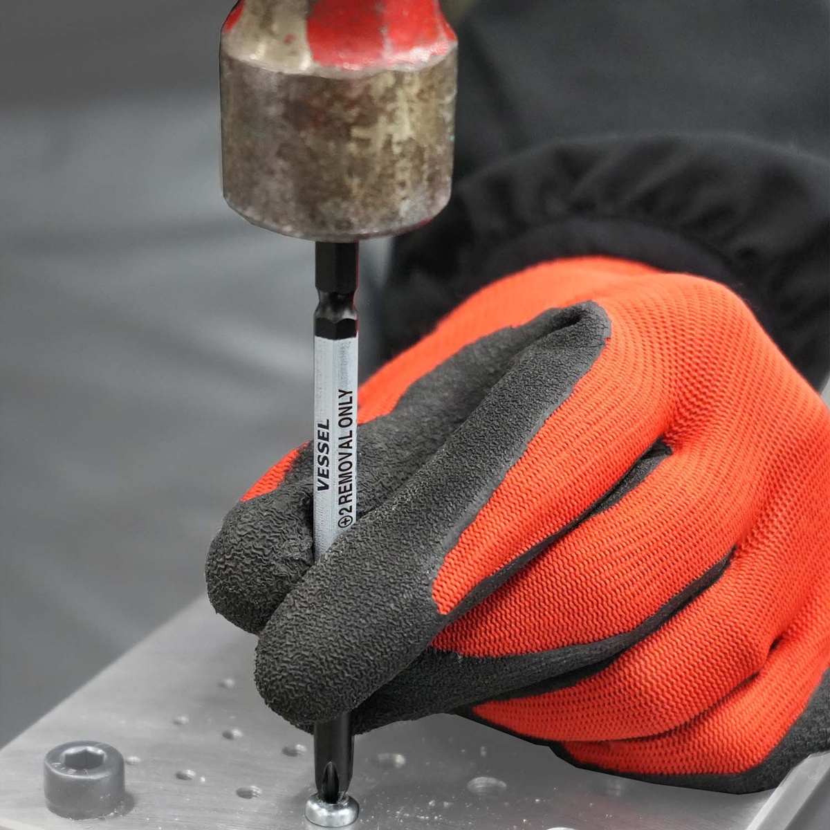 Vessel HZB10P01 IMPACT & OUT Screw Removing Bit Assortment being struck to seat the tip into a damaged screw head