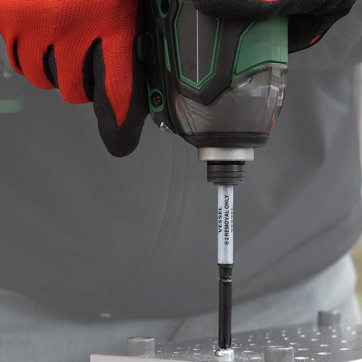Vessel HZB10P01 IMPACT & OUT Screw Removing Bit Assortment removing a stuck screw with an electric impact driver on metal