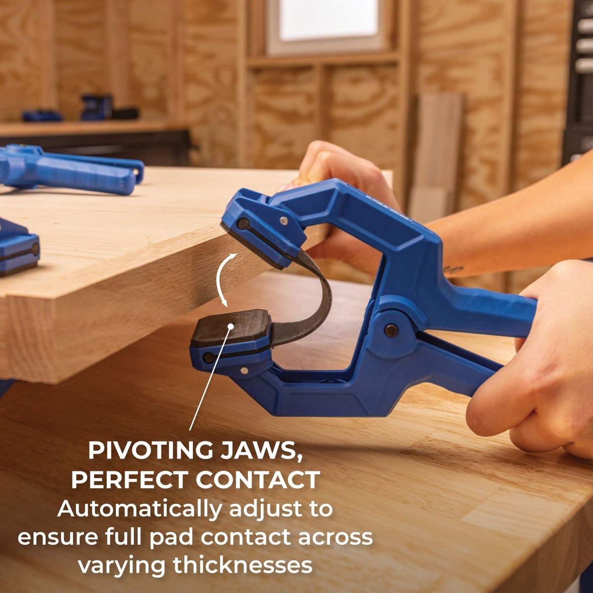 Kreg KEBC100 Edge Band Clamp clamping the edge of thick wood stock showing pivoting jaws for full pad contact