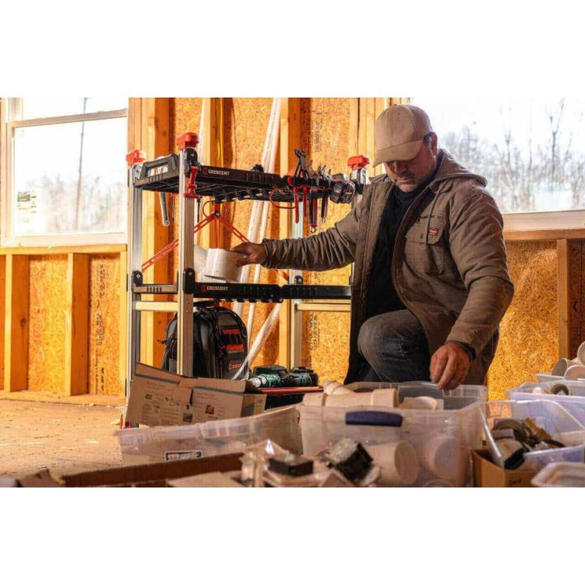 Crescent F3SCBL SITERUNNER 3 Shelf Folding Jobsite Cart holding tools and supplies inside a framed construction space during remodeling work