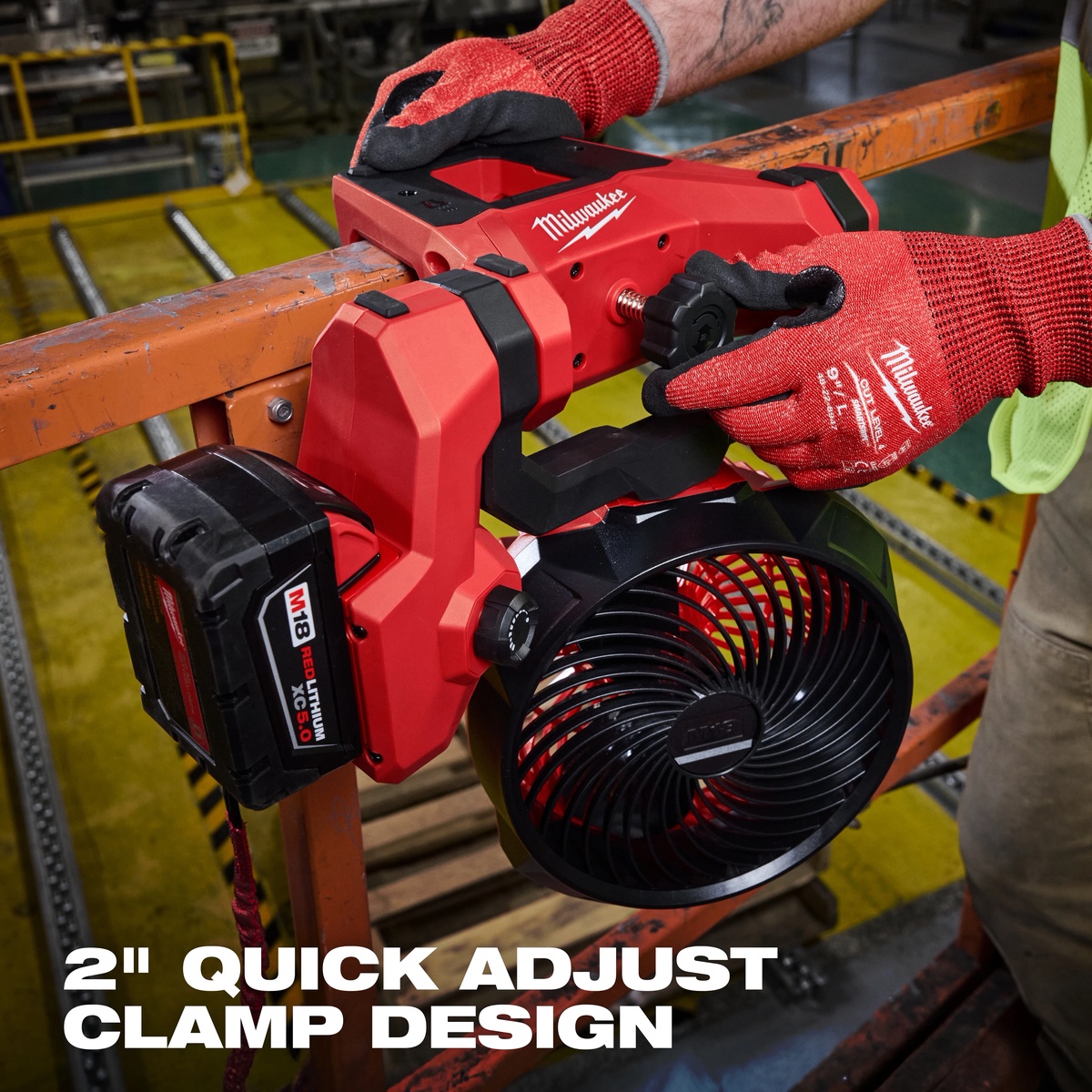 Milwaukee 0817-20 M18 Brushless Scissor Lift Fan clamped to a scissor lift rail during elevated commercial jobsite work