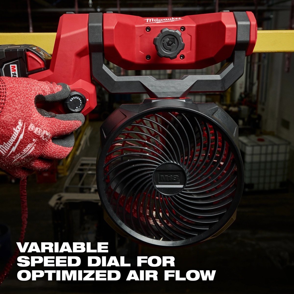 Milwaukee 0817-20 M18 Brushless Scissor Lift Fan variable speed dial being adjusted on an indoor jobsite