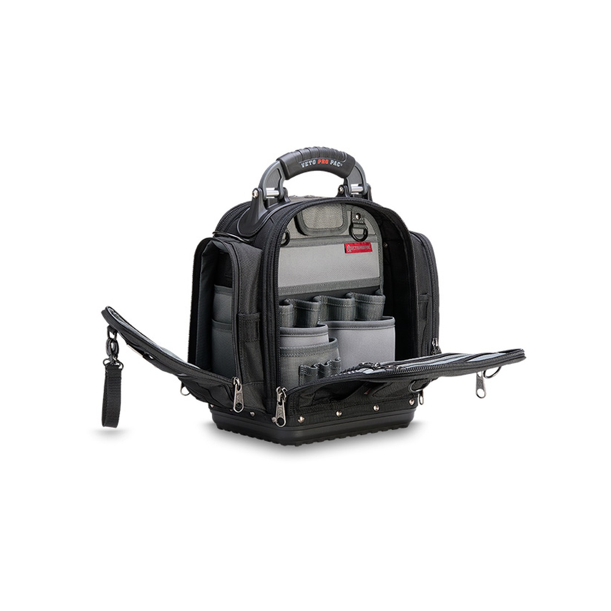 Veto Pro Pac TECH-MCTP Blackout Compact Service Tool Bag opened on a work surface showing interior tool pockets and removable panels for organized service tools and meter storage