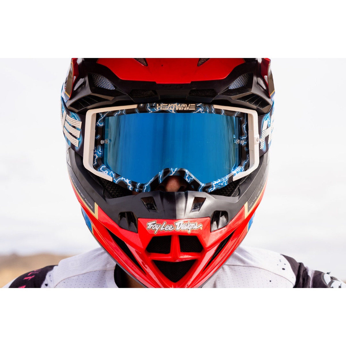 Heat Wave Visual MXG-250 Moto Goggle - Lightning worn with a motocross helmet during off-road riding for secure face fit and wide field of view