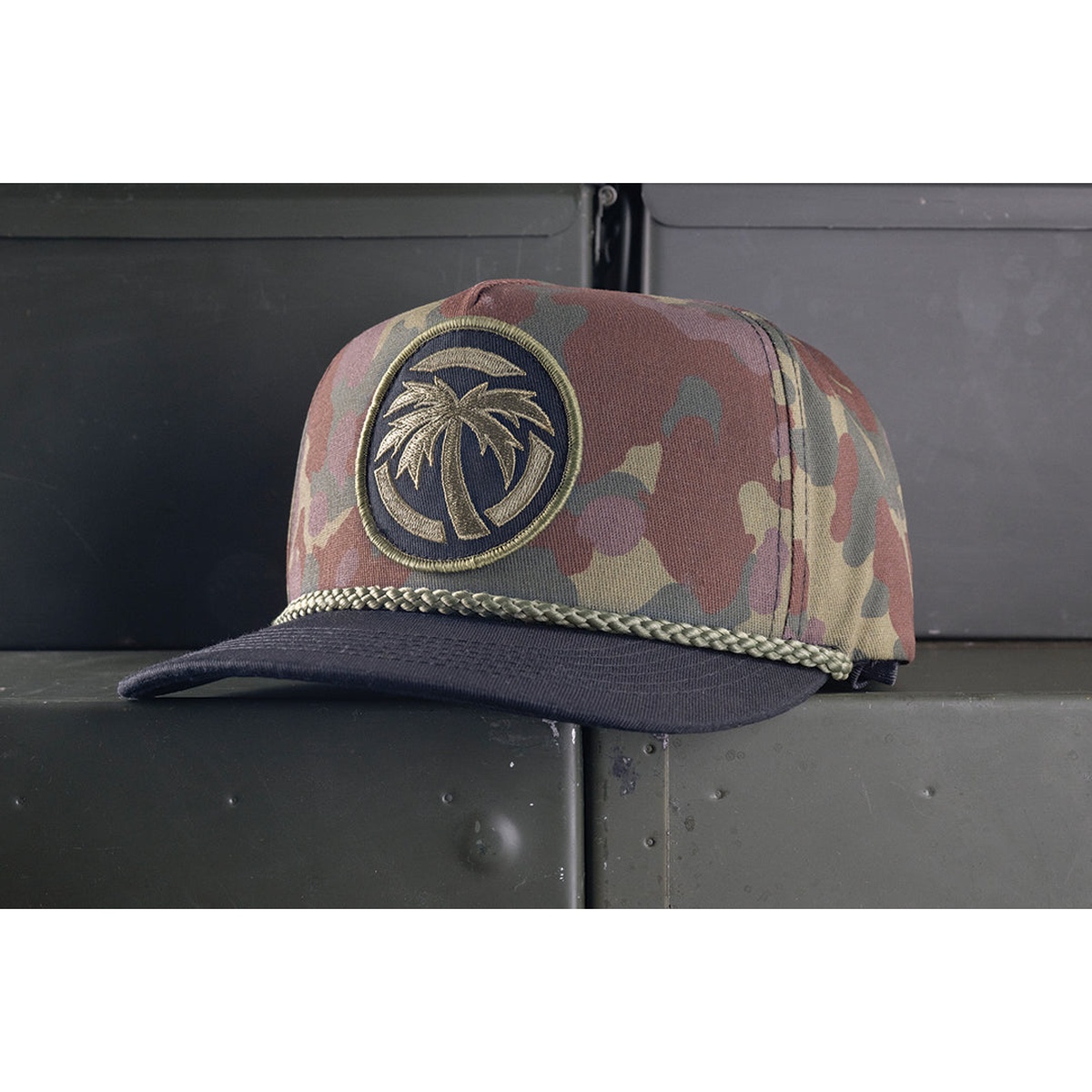 Heat Wave Visual HWV Fleck Camo Hat worn-ready with Flecktarn camo pattern and palm tree patch for casual everyday use