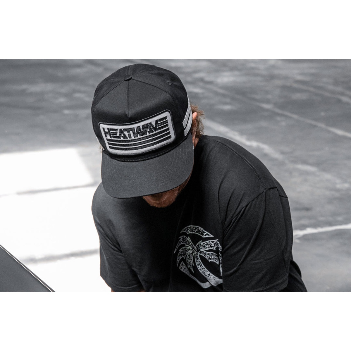 Heatwave Alloy Hat worn outdoors as a black casual hat for everyday lifestyle use