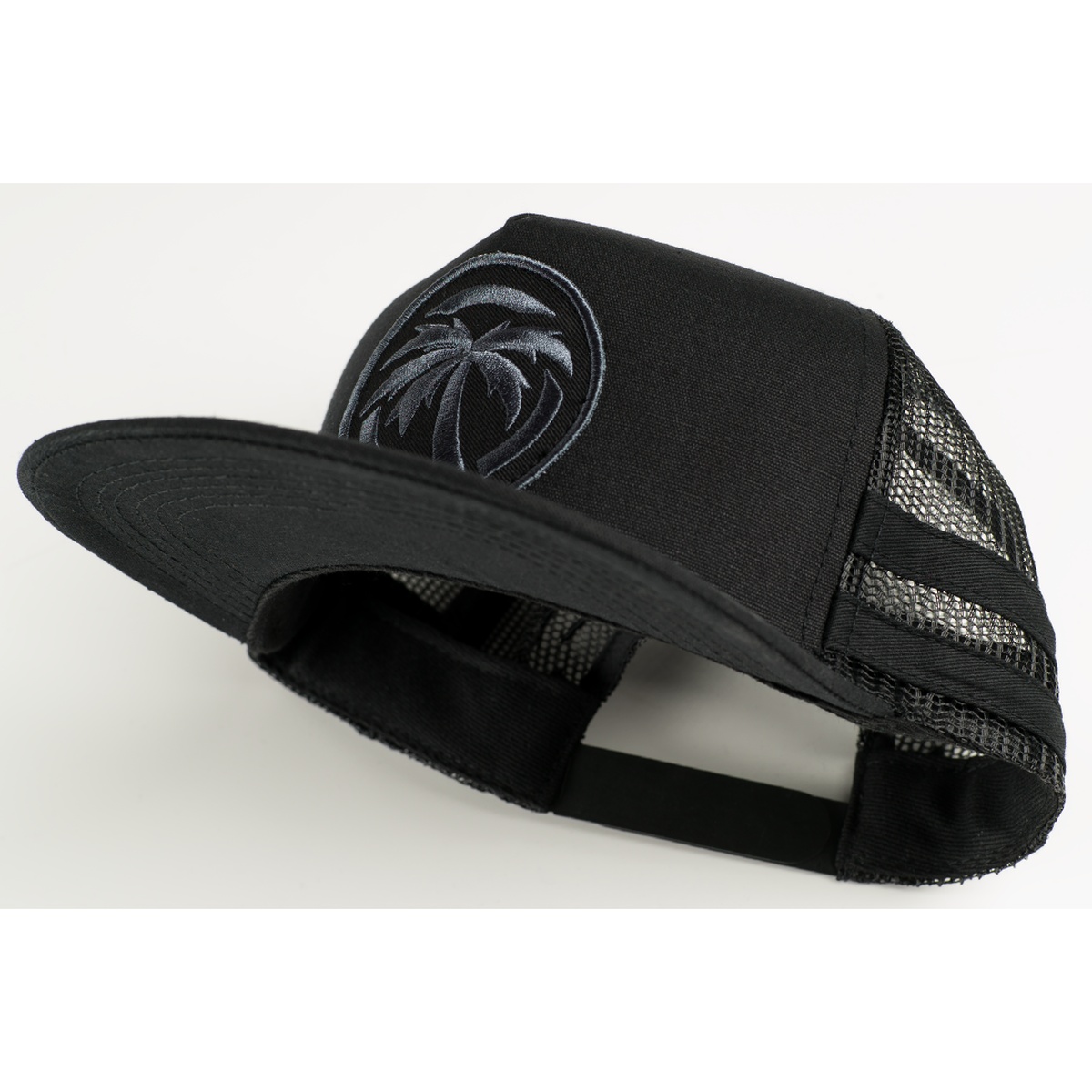Heat Wave Visual HWV Socom Trucker Hat angled view highlighting flat brim front panel and snapback fit for casual everyday use