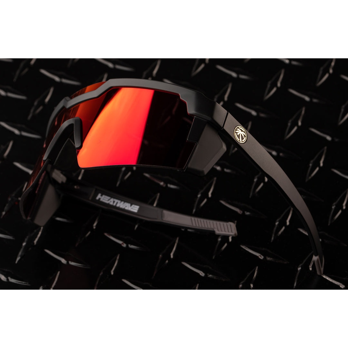 Heat Wave Visual Future Tech Sunglasses Firestorm Z87+ angled view highlighting black frame geometry and mirrored lens for performance safety eyewear use