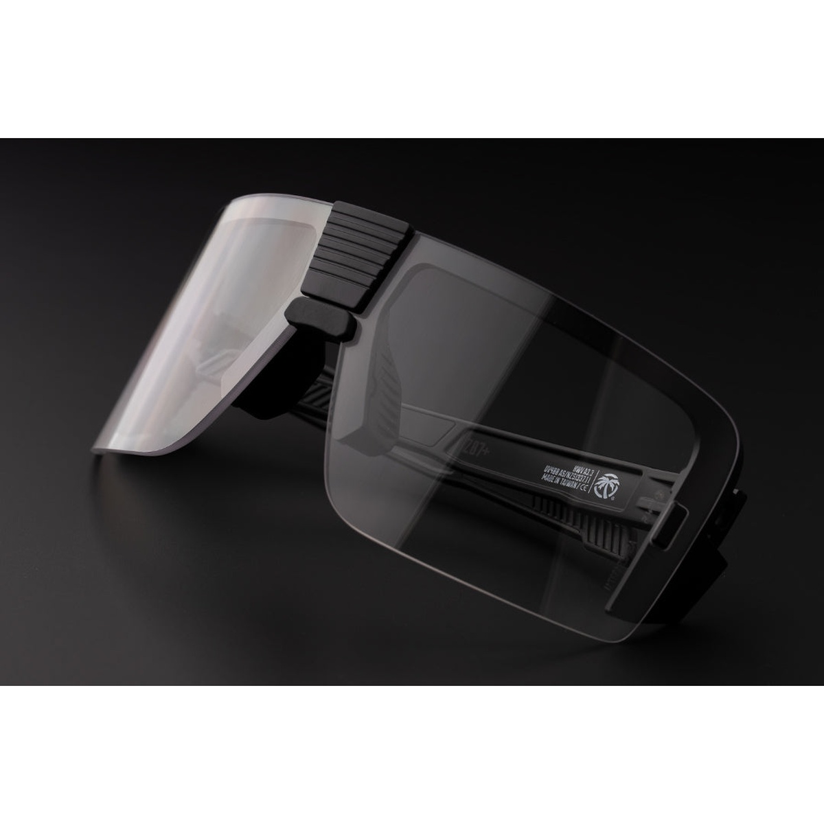 Heat Wave Visual XL Vector Sunglasses: Clear Z87+ laid on a bench with integrated side protection for debris, dust, and lateral impact exposure