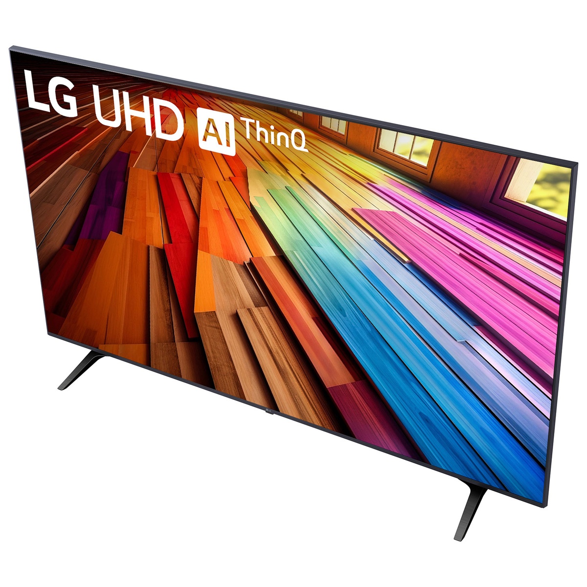 Angled top view showing the LG TV’s slim profile and two feet stand