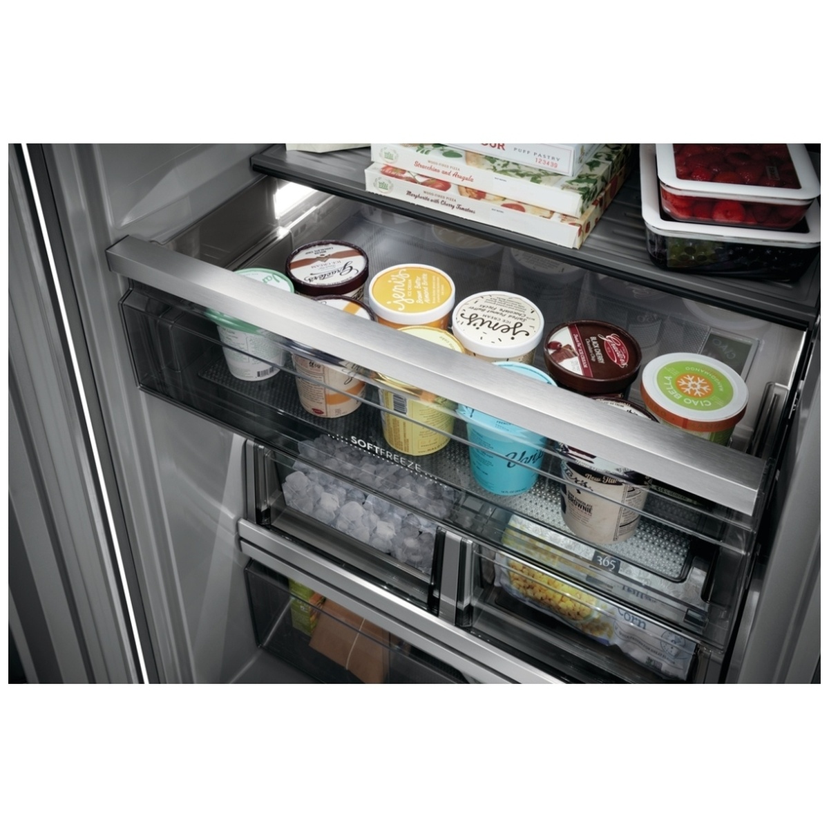 Soft Freeze drawer filled with ice cream pints above lower freezer drawers with ice cubes