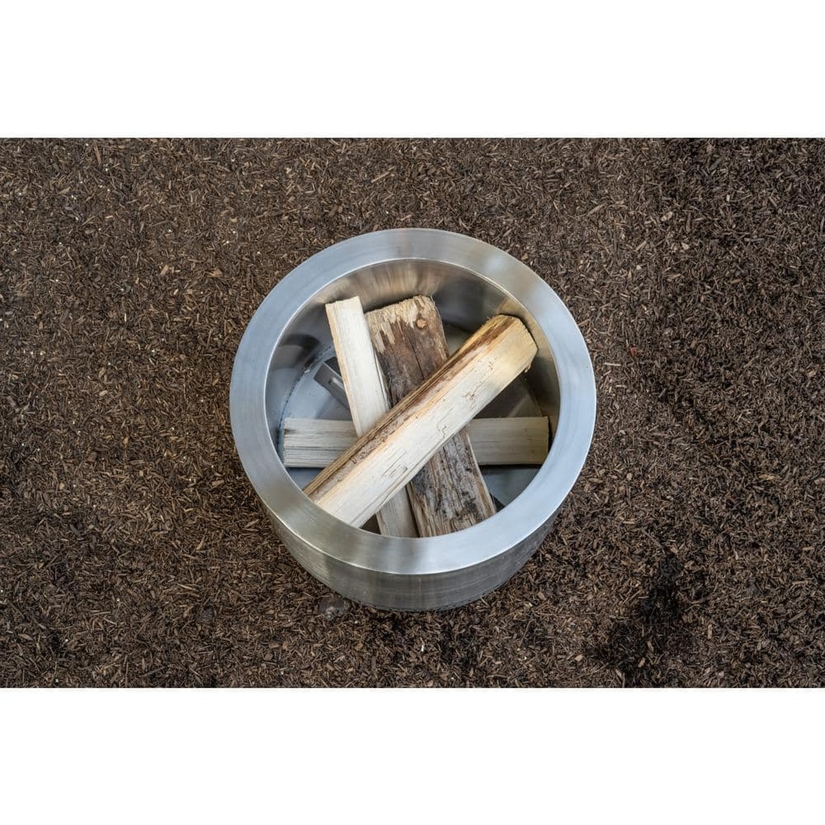 Top-down view loading logs inside the Explorer fire pit