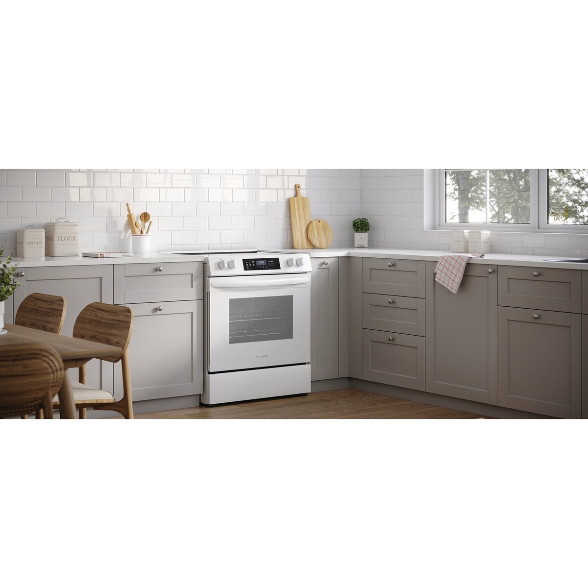 White Frigidaire range shown installed in a light grey kitchen, front-control design.