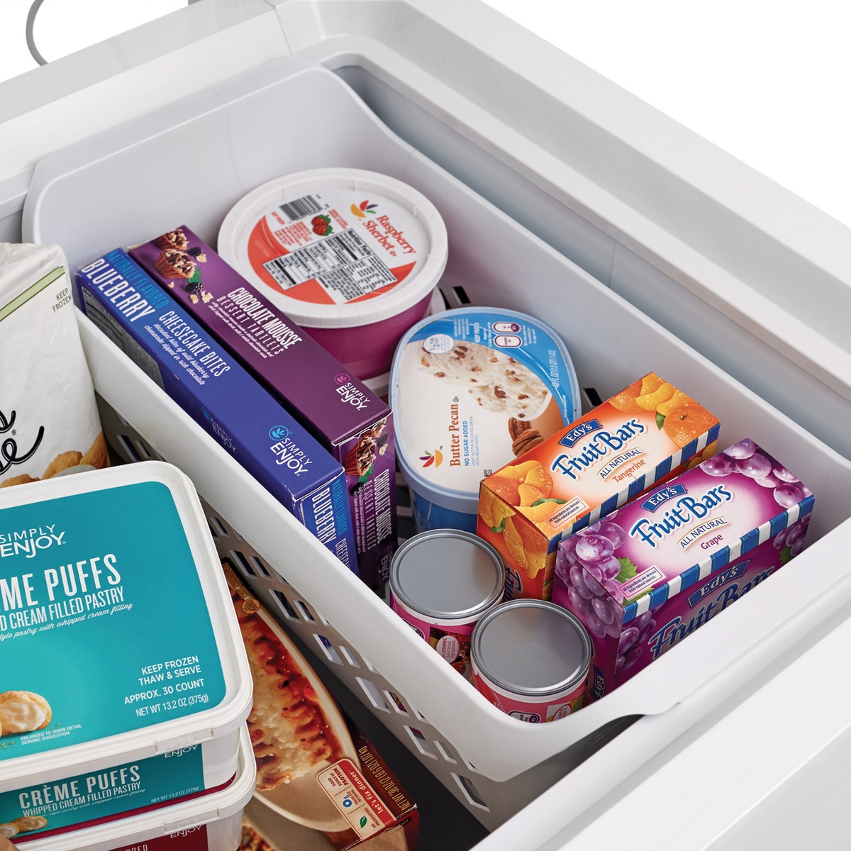 Close-up of sliding basket holding frozen treats and small items.