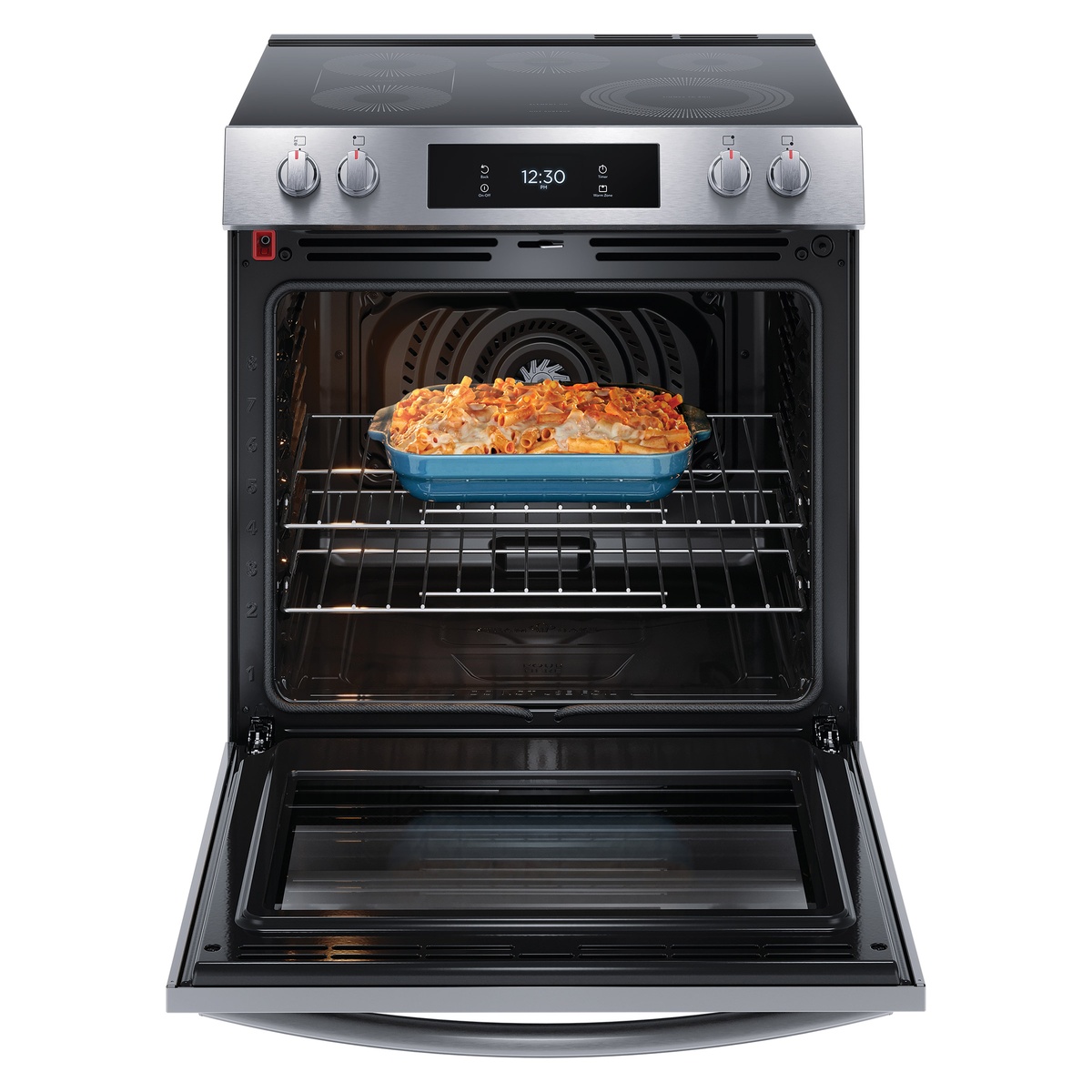 Open oven with casserole baking inside showing convection fan and interior racks.