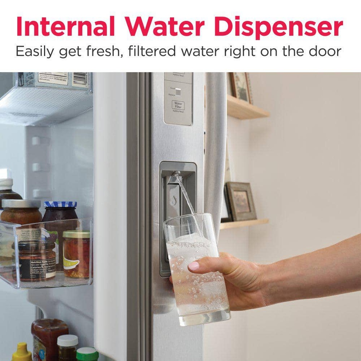 Internal water dispenser pouring filtered water into a glass inside the refrigerator door