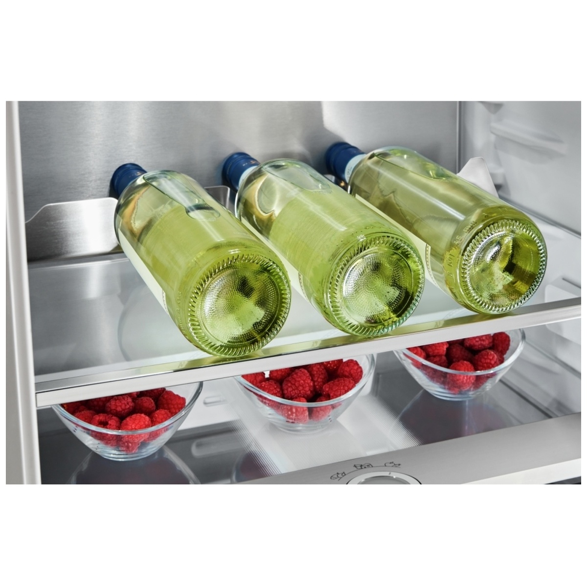Integrated bottle rack holding wine bottles inside the refrigerator