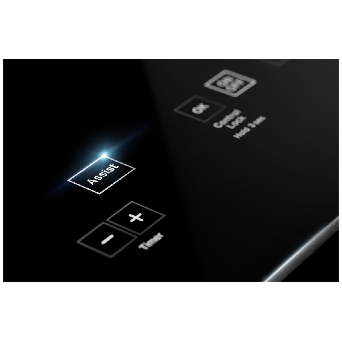 Close-up of the Assist button and timer controls on the cooktop glass surface.