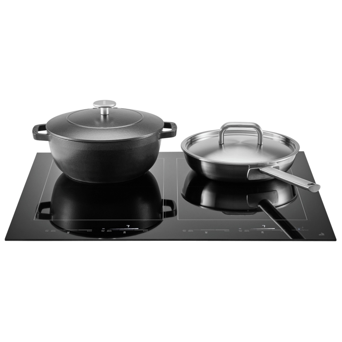 Cookware in use on the JennAir induction cooktop showing two pans heating on the rectangular zones