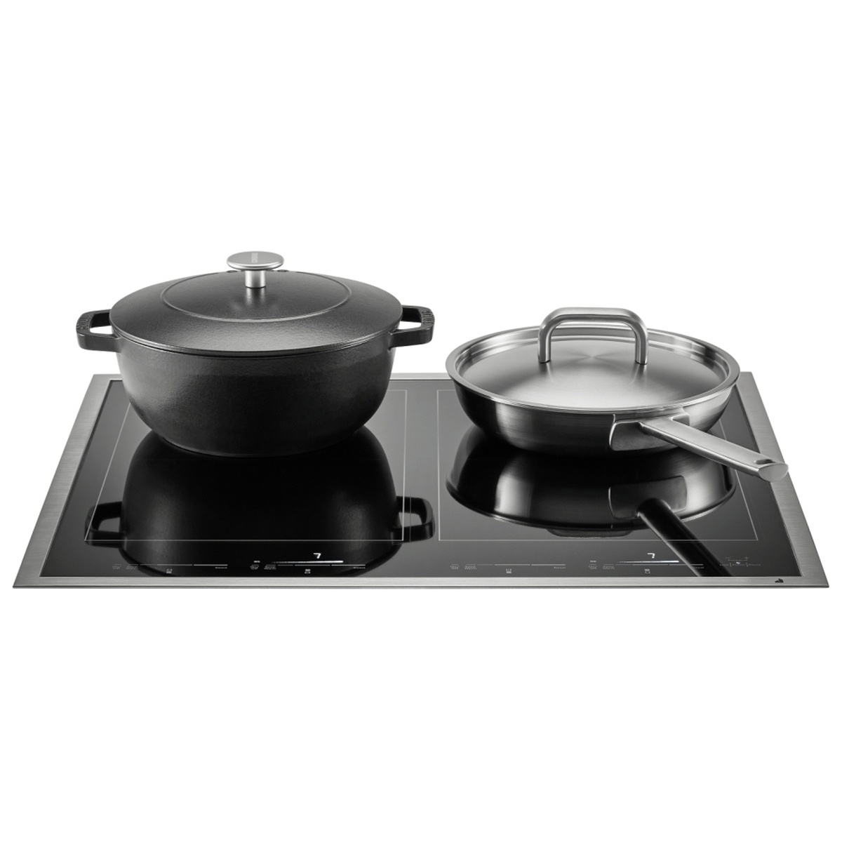 Cookware in use on the JennAir induction cooktop, showing two pots heating on the surface