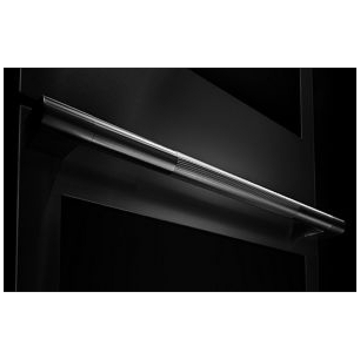 Detail of the oven's sturdy stainless bar handle with textured center grip