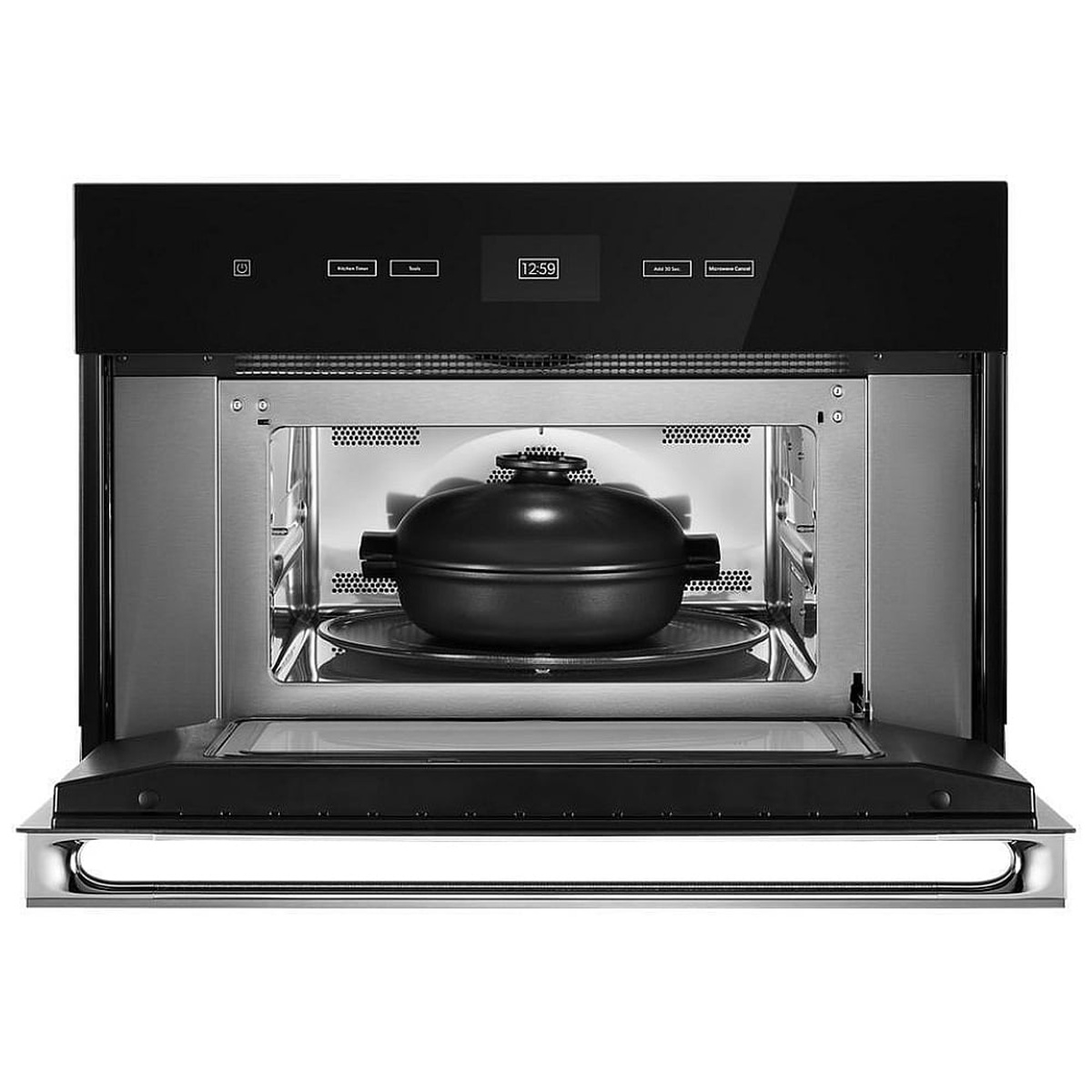 Microwave in use with cookware on the turntable under convection fan