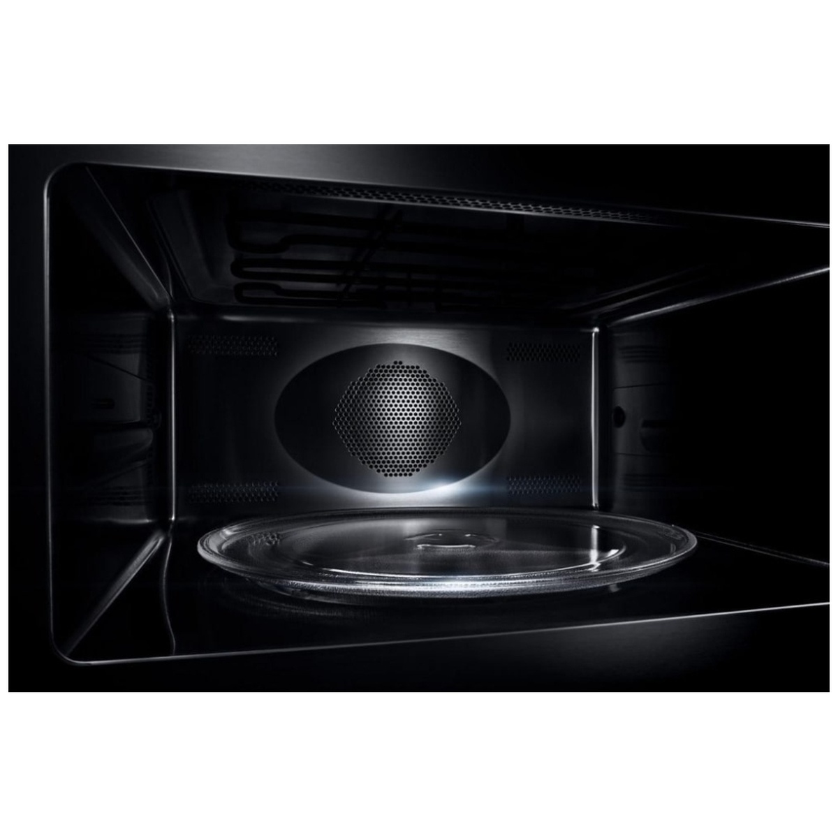 Stainless steel interior of the oven showing convection fan, lighting and glass turntable