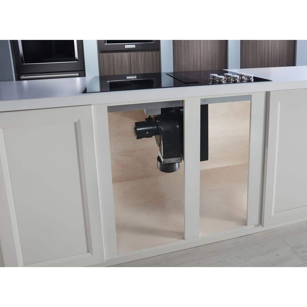 Under-counter view of the integrated downdraft ventilation system.