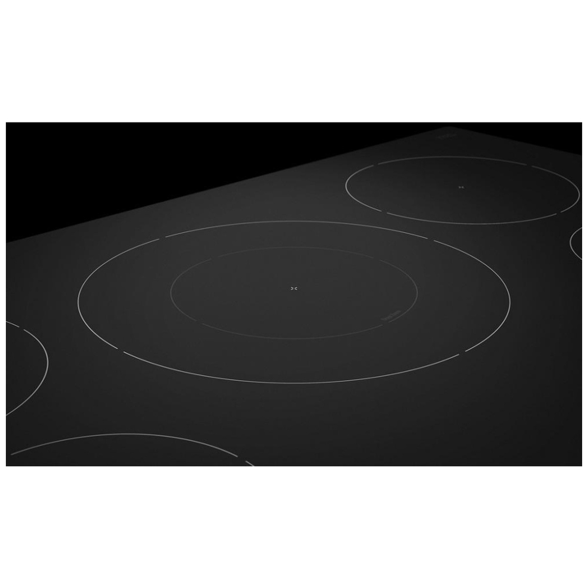 Close-up of the center dual cooking zone with two concentric rings on the cooktop.