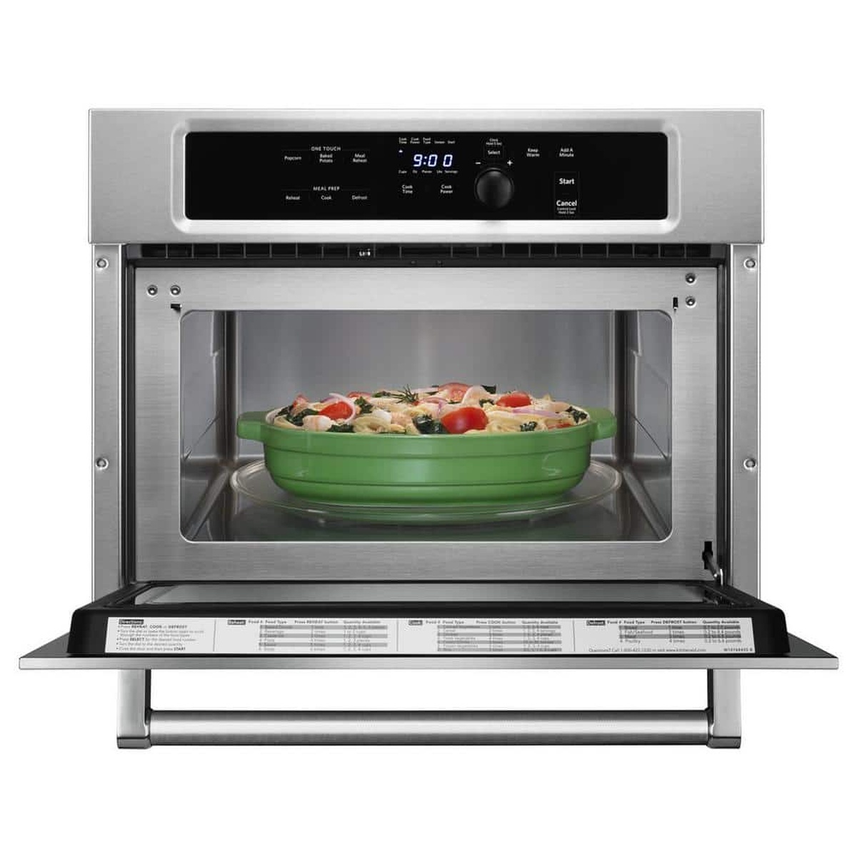 Open KitchenAid built-in convection microwave with dish inside and stainless interior