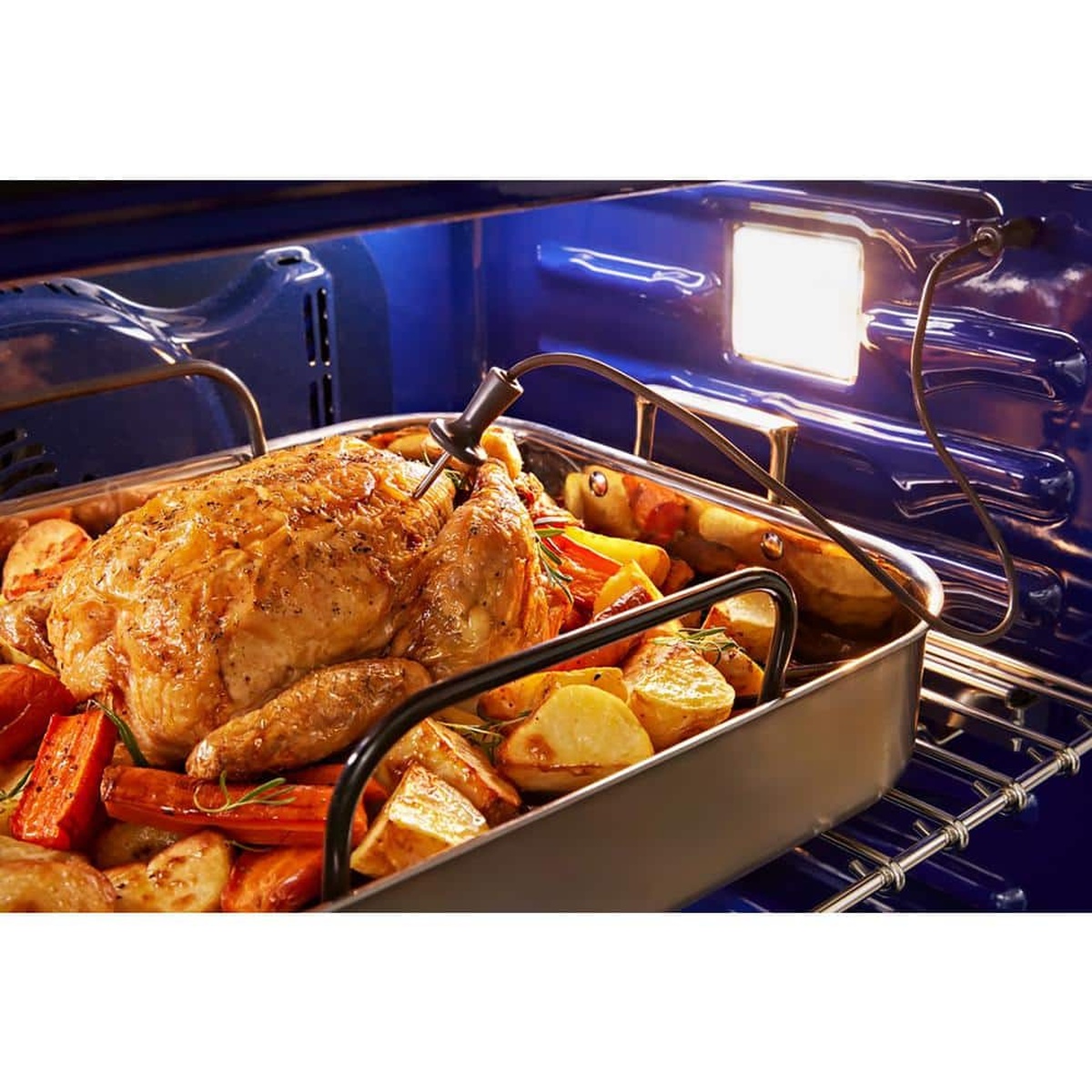 Roast chicken with vegetables using the integrated meat thermometer inside the oven.