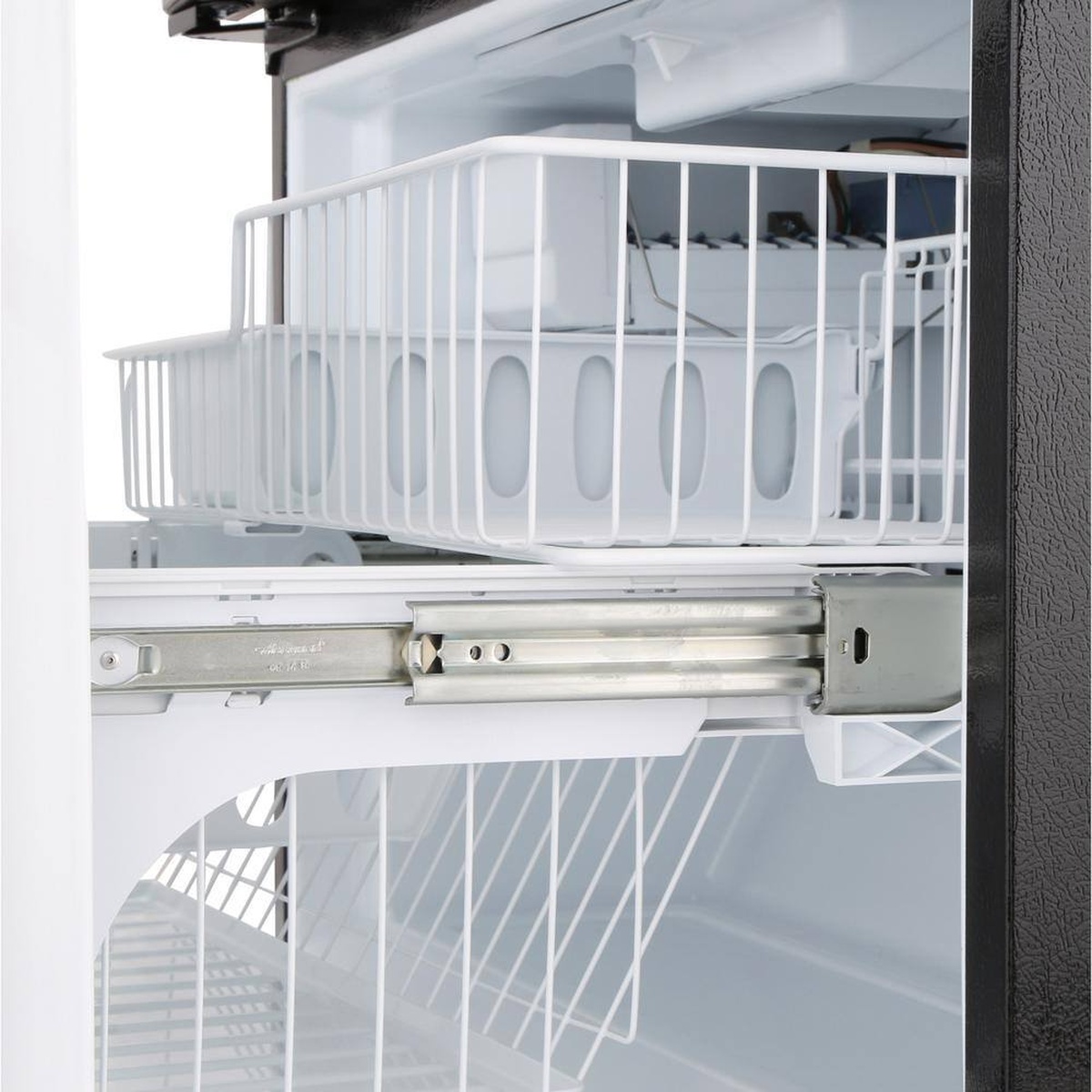 Bottom freezer drawer with sliding baskets and built-in ice maker