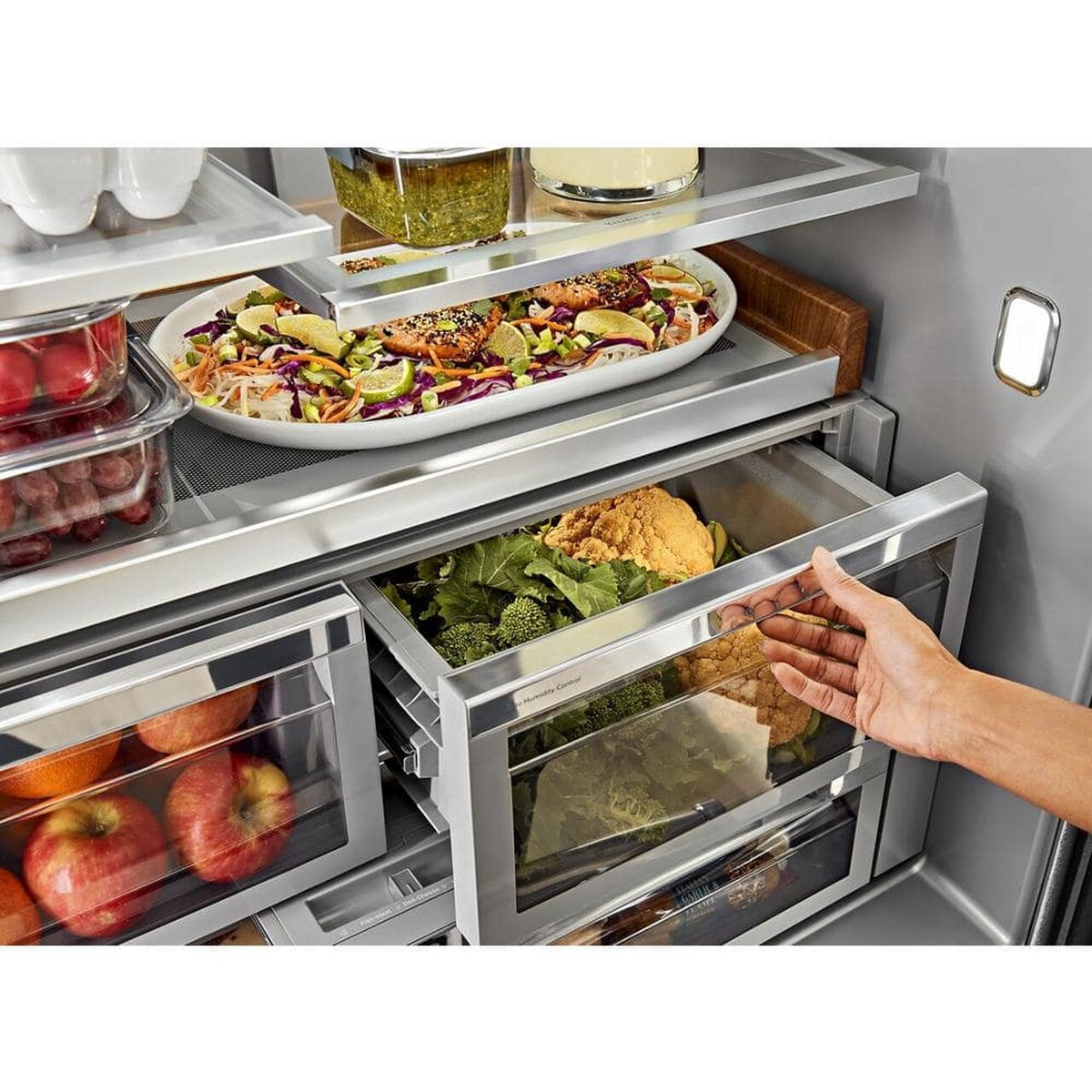 FreshChill pantry and crisper drawers being adjusted inside the refrigerator