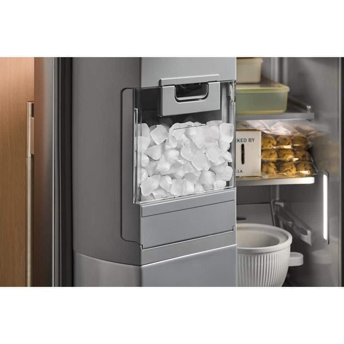 In‑Door‑Ice system bin located in the freezer door with clear view of ice
