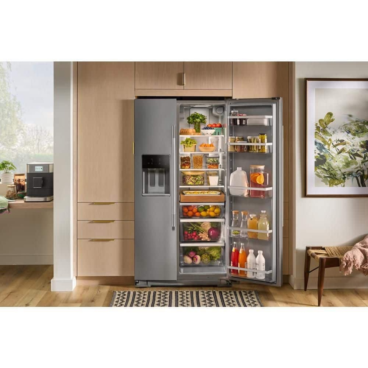 Counter‑depth refrigerator shown built in with door open revealing organized storage