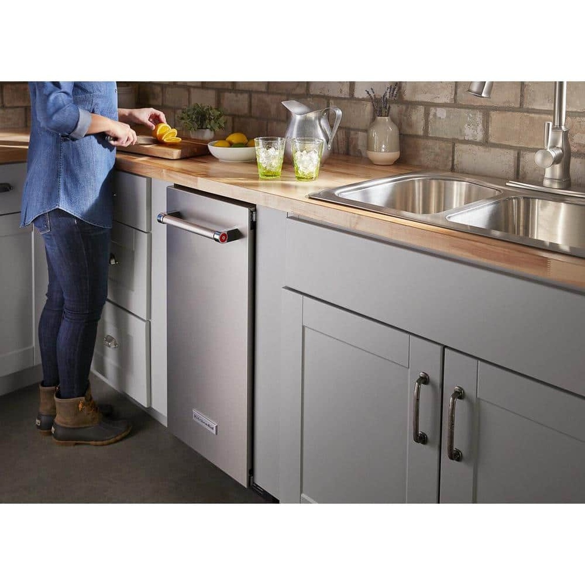 KitchenAid undercounter ice maker installed flush in a modern kitchen