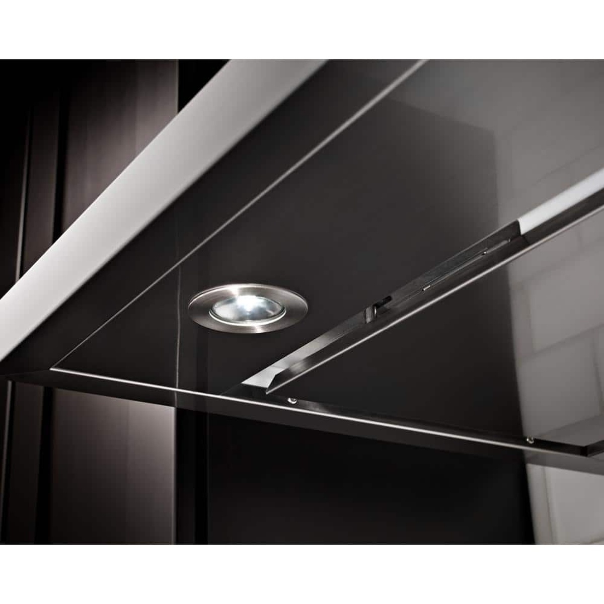 Underside close-up of KitchenAid hood showing perimeter venting and LED puck light