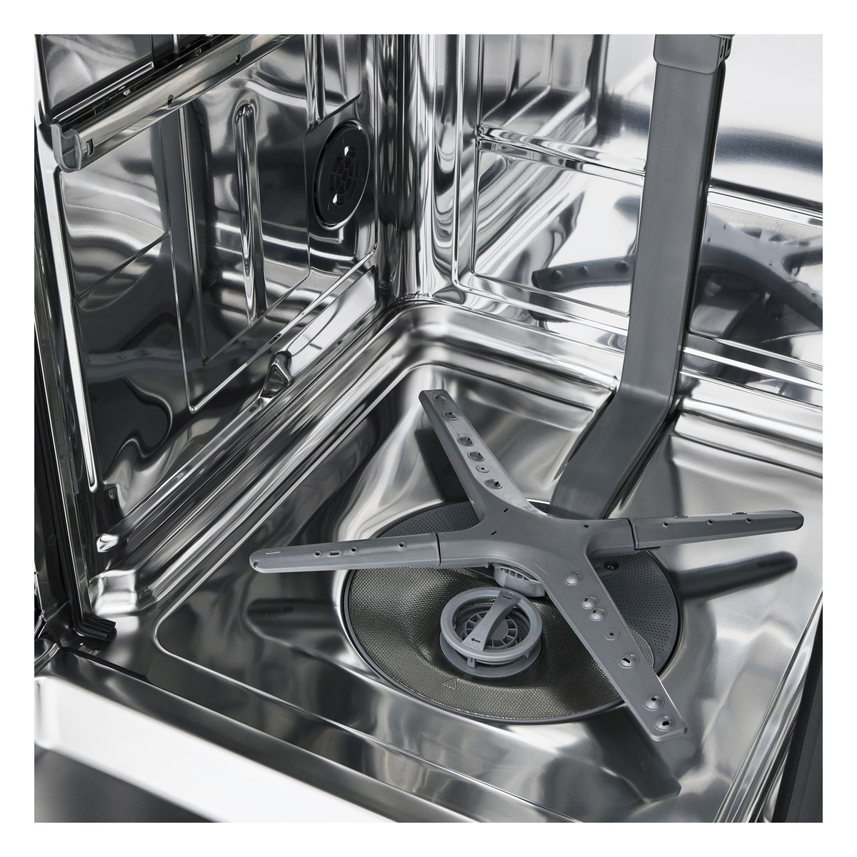 Close-up of QuadWash spray arm system inside the stainless tub.