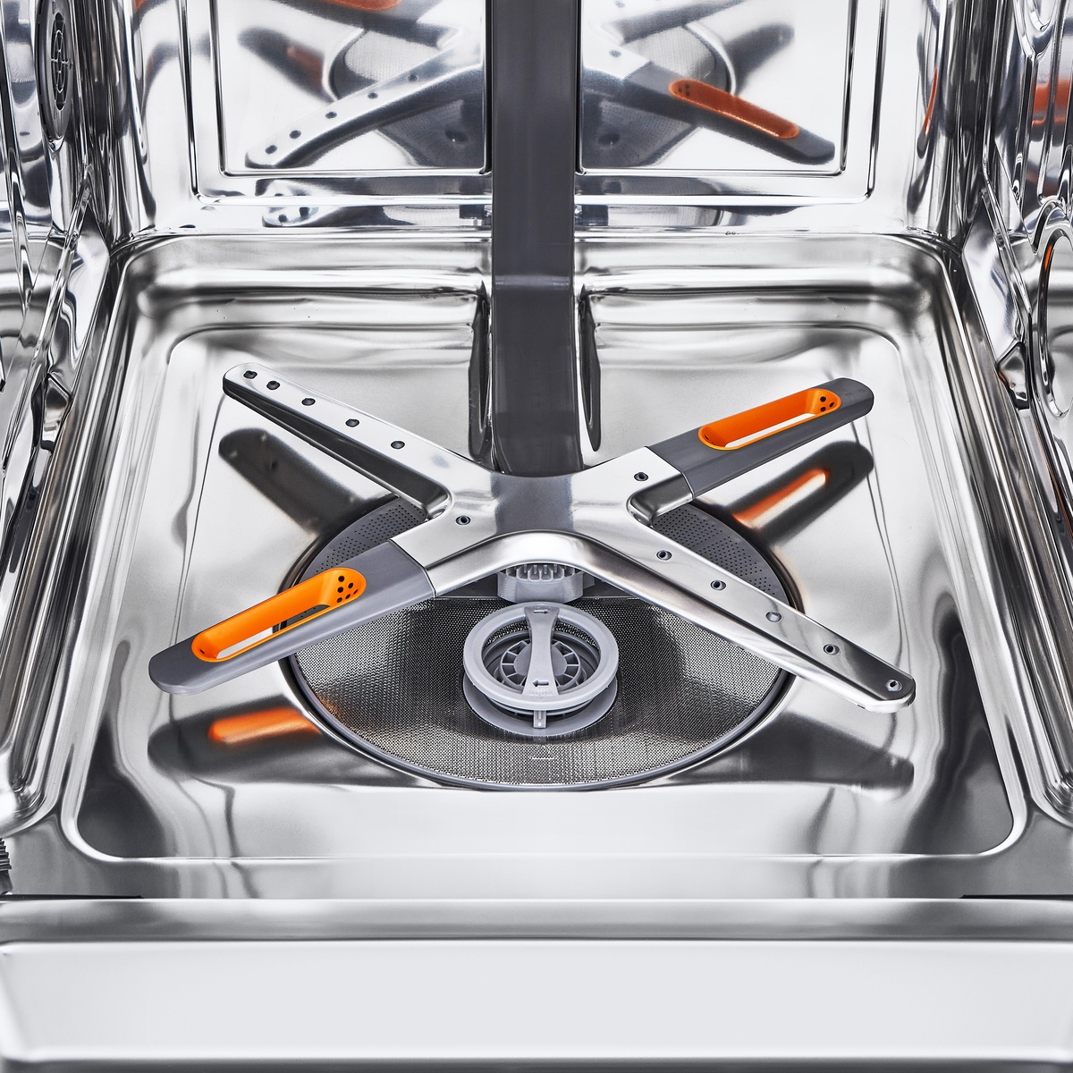Close-up of QuadWash Pro spray arms inside stainless tub