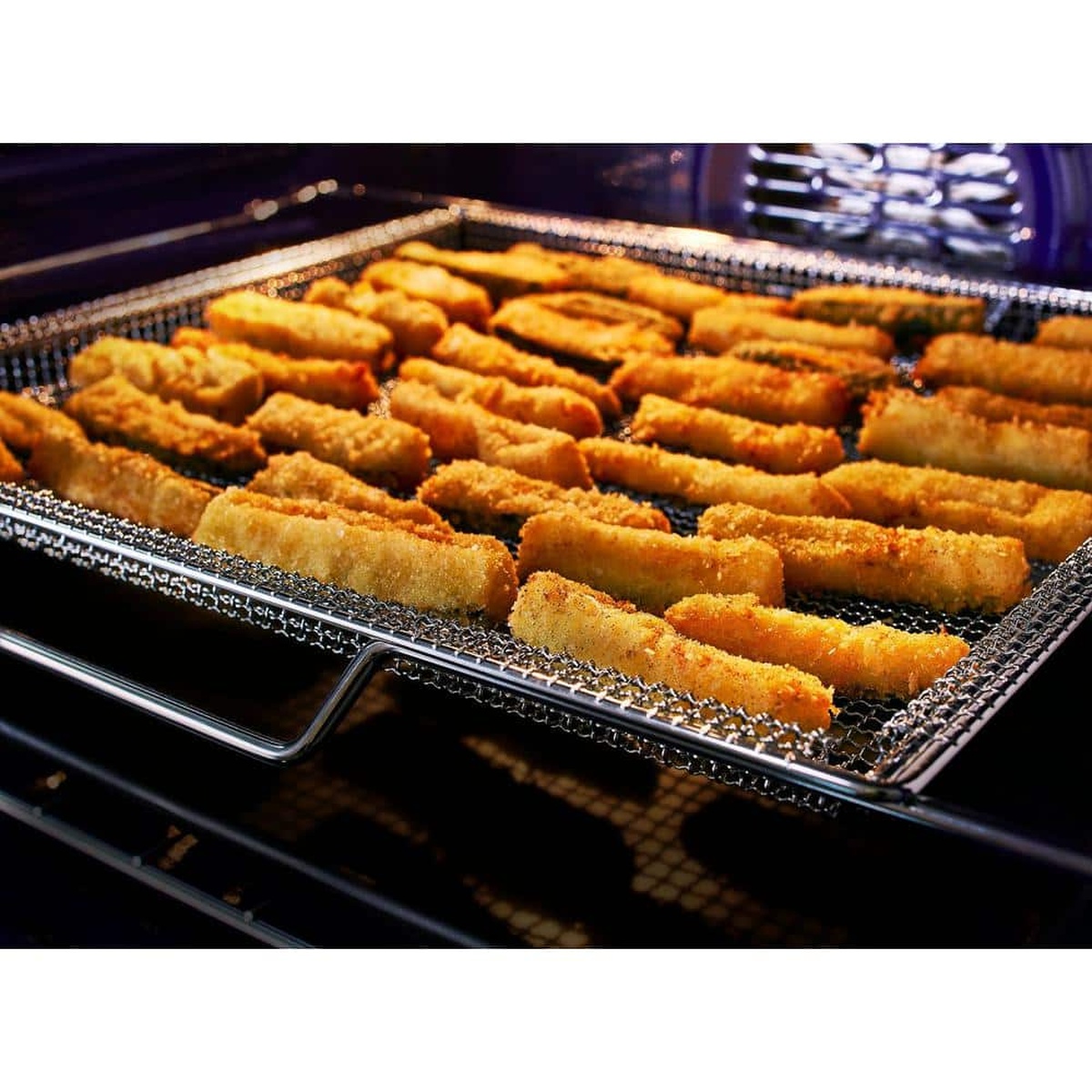 AirFry tray with crispy breaded snacks inside the oven