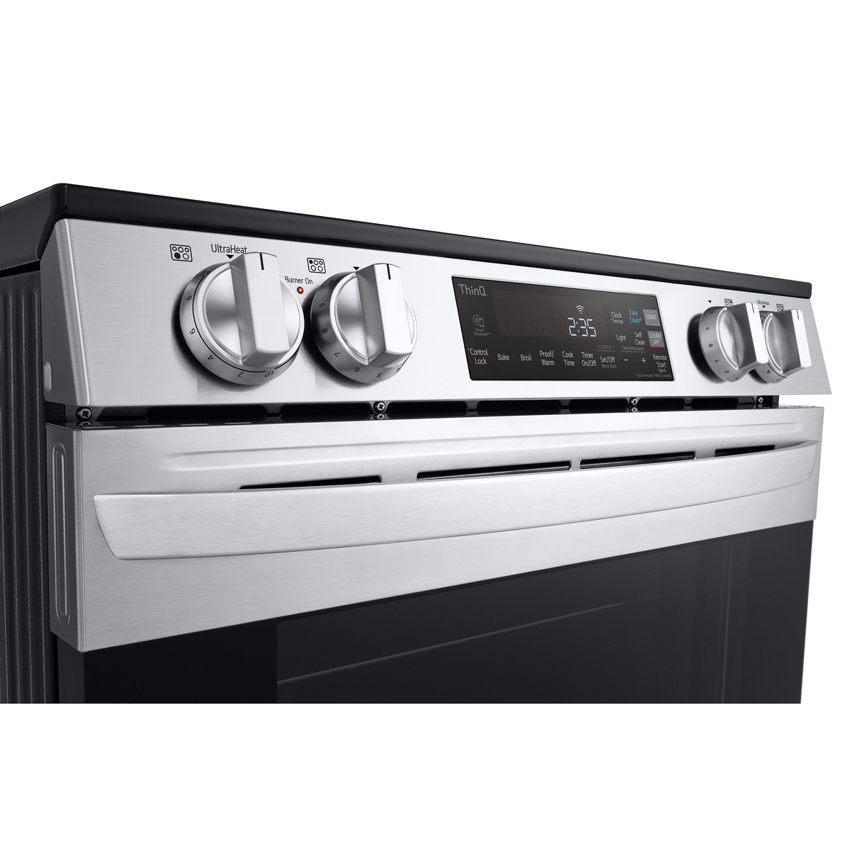 Close-up of LG ThinQ control panel and stainless knobs on the slide-in range.