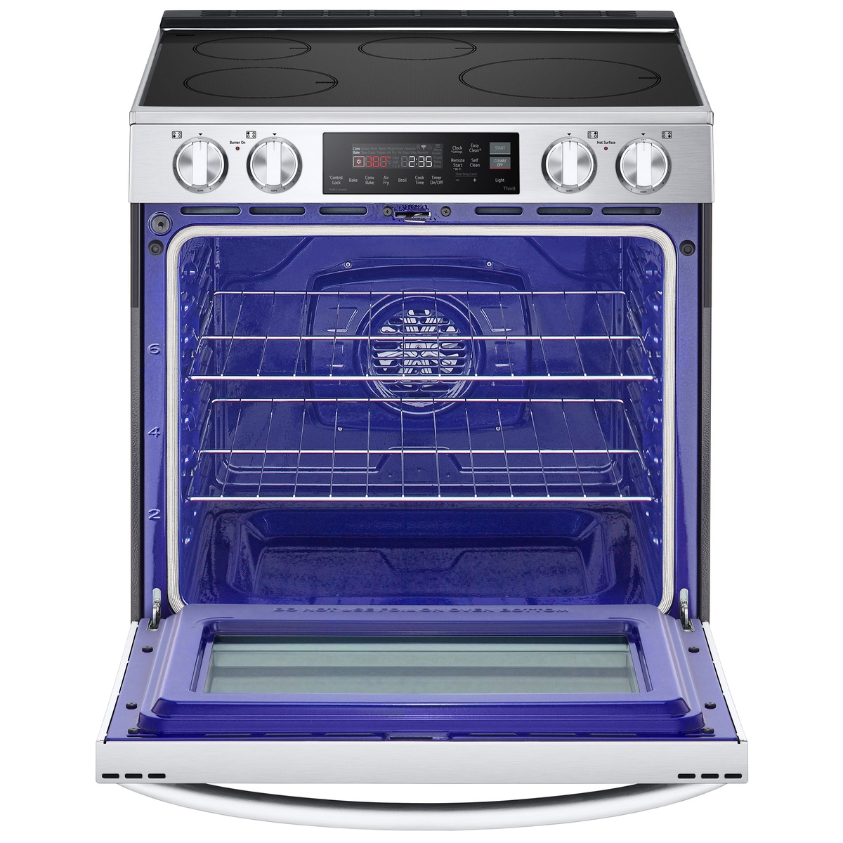 Open LG slide‑in induction range showing spacious blue oven interior with two racks and rear convection fan.