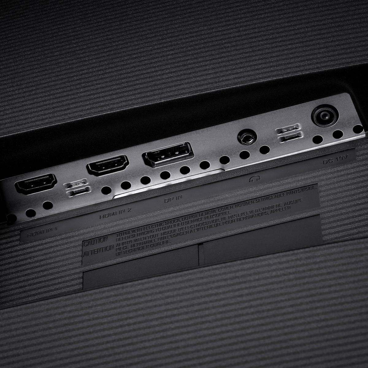 Close-up of monitor ports including two HDMI, one DisplayPort, audio out, and power.