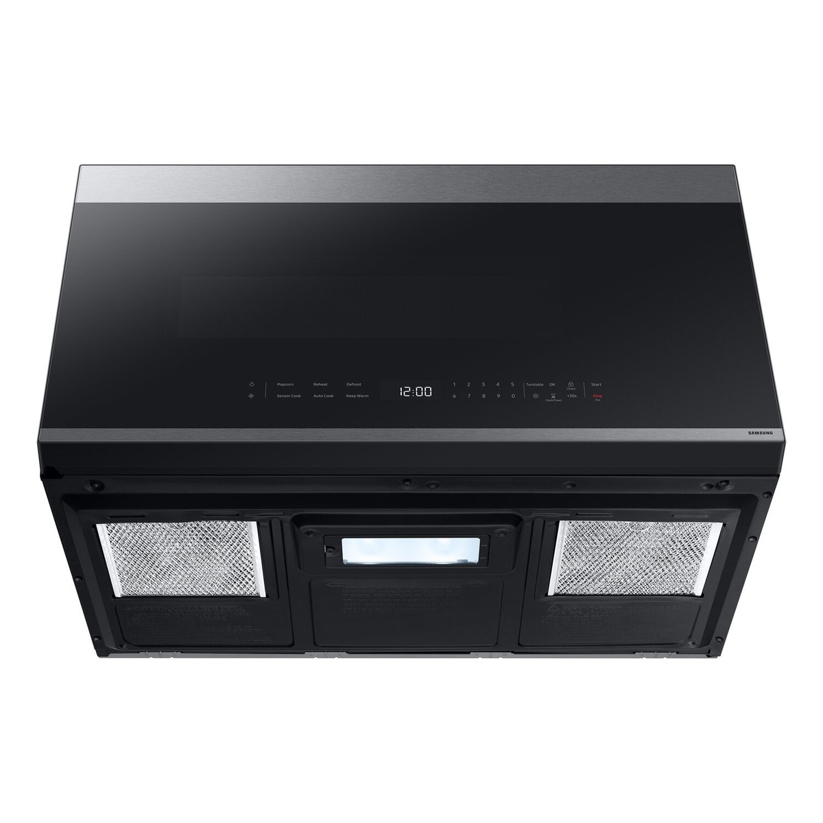 Underside view of microwave with dual filters and center light for cooktop.