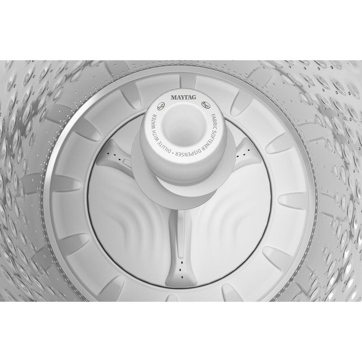 Washer tub interior showing center agitator and dispenser