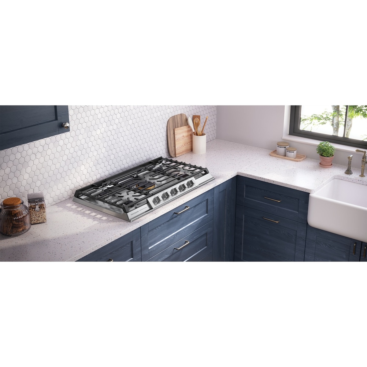 Frigidaire 36-inch gas cooktop installed in a modern kitchen corner, showing low-profile stainless design.